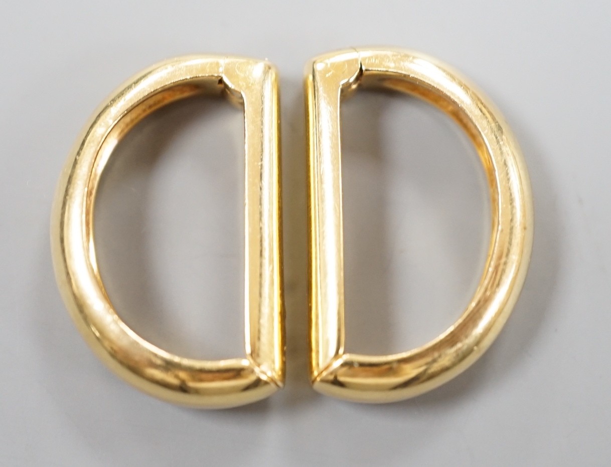 A modern pair of Cartier 750 yellow metal demi-lune cufflinks, each numbered 659650, 24mm, 12.5 grams, in Cartier pouch.